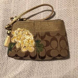Signature Coach floral wristlet EUC